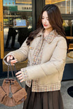 Woman holding a brown handbag in an urban setting