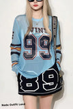 Person wearing a light blue oversized shirt with '99' and a black skirt with '89', standing against a white background.