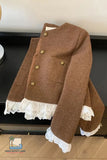 Brown jacket with lace trim on a wooden surface