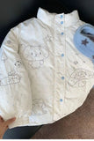 Baby jacket with cartoon cat design on a dark surface