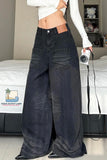 Person wearing wide-leg jeans in a bedroom setting with a camera and camera bag.