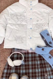 White jacket with embroidered designs on a checkered surface with headphones and a blue scarf.