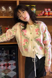 Woman wearing a floral blouse in a kitchen setting