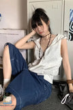 Person sitting on the floor with a casual pose in an indoor setting