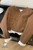 Brown jacket with lace trim on a wooden surface