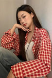 Upgrade your 90s Grunge Aesthetic with this Long Sleeve Classic Red Plaid Blouse Shirt. The ultimate essential for Americana everyday outfits, oversized red checkered flannel trends, and cozy autumn layering lookbooks. Featuring a flattering relaxed drape and a timeless tartan pattern, this versatile top is a must-have for your Button Up Shirts or Vintage Clothing collection.
