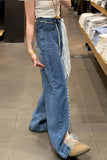 Person wearing blue jeans with lace detailing in a store setting