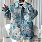 Floral patterned jacket worn by a person, with a neutral background