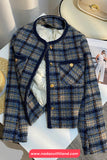 Plaid jacket on a mannequin with a blurred background