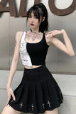 Person wearing a black top and skirt with a white graphic on a neutral background