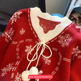 Red sweater with white snowflake patterns and drawstrings, brand 'Nada Outfitland' visible.
