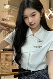 Woman holding a glass of iced coffee in a casual setting