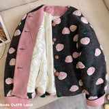 Coat with pink floral pattern on a beige surface