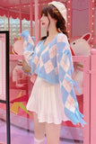 Woman wearing a blue and white checkered poncho in a pink-themed room with plush toys.