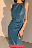 Woman wearing a blue dress with a plain background