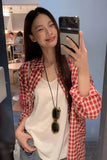 Upgrade your 90s Grunge Aesthetic with this Long Sleeve Classic Red Plaid Blouse Shirt. The ultimate essential for Americana everyday outfits, oversized red checkered flannel trends, and cozy autumn layering lookbooks. Featuring a flattering relaxed drape and a timeless tartan pattern, this versatile top is a must-have for your Button Up Shirts or Vintage Clothing collection.