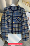 Plaid jacket on a mannequin with a visible brand logo at the bottom.