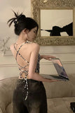 Woman holding a laptop in a stylish room with decorative elements