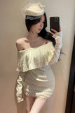 Woman wearing a white off-shoulder dress and headpiece, taking a mirror selfie.