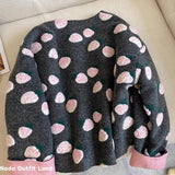 Floral patterned sweater on a beige couch