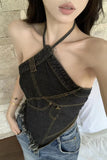 Person wearing a denim halter top with a white background