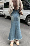 Upgrade your Y2K Whimsigoth Aesthetic with this High Waist Irregular Style Mermaid Denim Skirt. The ultimate essential for Korean streetwear outfits, asymmetric fishtail maxi skirt trends, and dramatic denim lookbooks. Featuring a flattering snatched high-rise waist and a cascading ruffled wave hem, this long jean skirt is a must-have for your Aesthetic Skirts