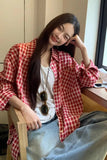Upgrade your 90s Grunge Aesthetic with this Long Sleeve Classic Red Plaid Blouse Shirt. The ultimate essential for Americana everyday outfits, oversized red checkered flannel trends, and cozy autumn layering lookbooks. Featuring a flattering relaxed drape and a timeless tartan pattern, this versatile top is a must-have for your Button Up Shirts or Vintage Clothing collection.