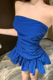 Blue strapless dress on a neutral background