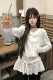 Person holding a drink in a casual indoor setting