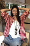 Upgrade your 90s Grunge Aesthetic with this Long Sleeve Classic Red Plaid Blouse Shirt. The ultimate essential for Americana everyday outfits, oversized red checkered flannel trends, and cozy autumn layering lookbooks. Featuring a flattering relaxed drape and a timeless tartan pattern, this versatile top is a must-have for your Button Up Shirts or Vintage Clothing collection.