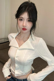Woman wearing a white blouse with a blurred background