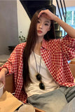 Upgrade your 90s Grunge Aesthetic with this Long Sleeve Classic Red Plaid Blouse Shirt. The ultimate essential for Americana everyday outfits, oversized red checkered flannel trends, and cozy autumn layering lookbooks. Featuring a flattering relaxed drape and a timeless tartan pattern, this versatile top is a must-have for your Button Up Shirts or Vintage Clothing collection.
