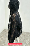 Black floral lace dress on a mannequin against a white wall with 'www.nadaoutfitland.com' text at the bottom.