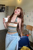 Woman holding a cup in a casual indoor setting
